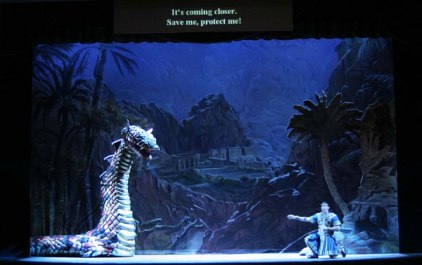 Tamino is attacked by the serpent in Sarasota Opera's 2004 production of The Magic Flute (Stage Director: William Gustason Set Designer: Troy Hourie)